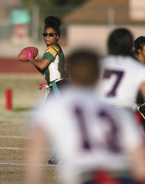 Rancho’s Kayla Holbert (1) looks to pass the ball during a flag football game against ...