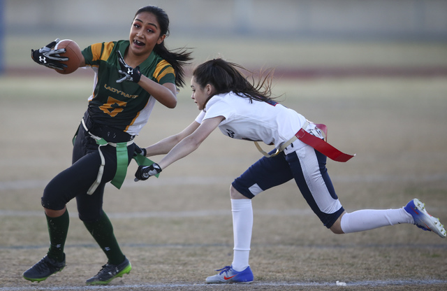 Rancho’s Christina Parada (6) is tagged out by Coronado’s Lexie Potts (4) during ...