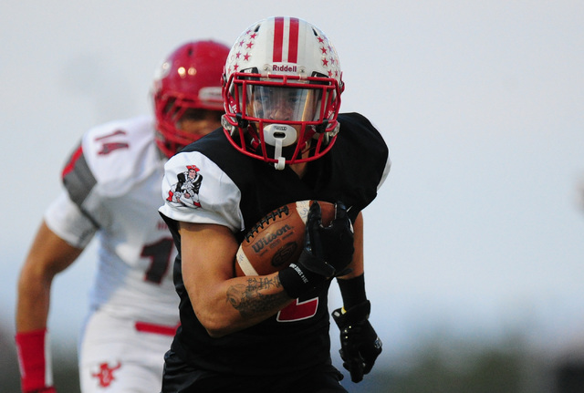 Liberty wide receiver Ethan Dedeaux scores a touchdown against Arbor View in the first half ...
