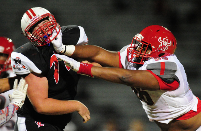 Arbor View defensive tackle Greg Rogers, right, battles Brendon Sandoval in the first half o ...