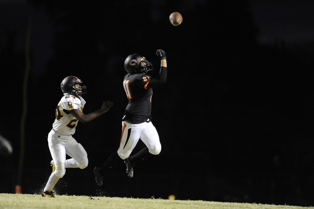 Chaparral tight end Adrian Zarate, right, reaches up in attempt to ctach an overthrown pass ...
