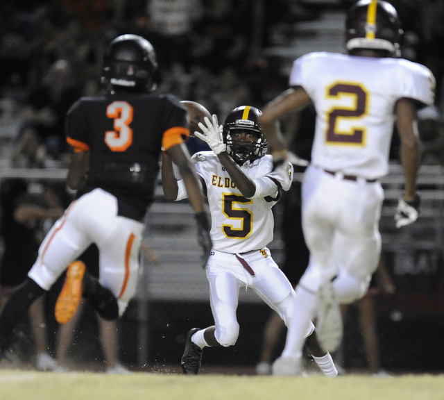Eldorado wide receiver Carl Crayon (5) catches a pass against the Chaparral Cowboys in the s ...