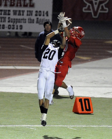 Arbor View defensive back Charles Louch (21) intercepts a pass intended for Palo Verde runni ...