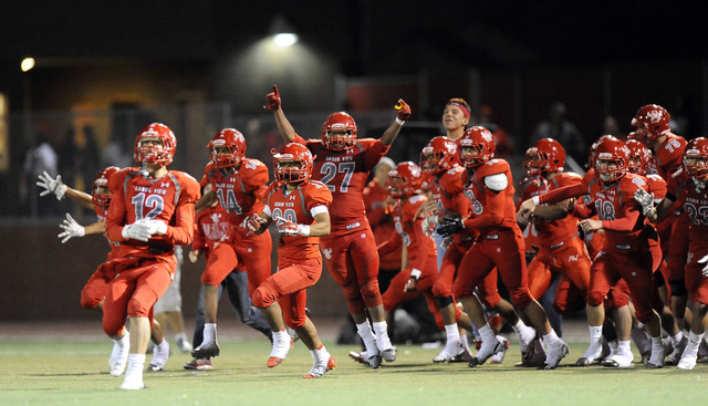 Arbor View players celebrate their 27-7 win over Palo Verde in Sunset Region semifinals on F ...