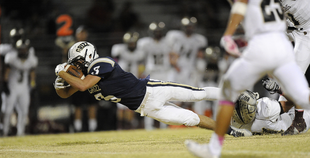 Spring Valley running back Michael Bianco (3) dives for extra yardage after gaining a first ...