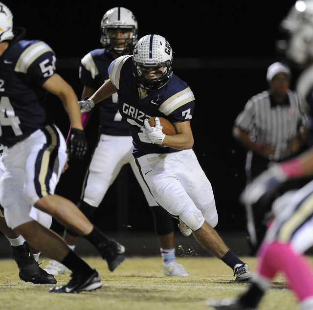 Spring Valley running back Michael Bianco (3) rushes against Faith Lutheran in the first hal ...