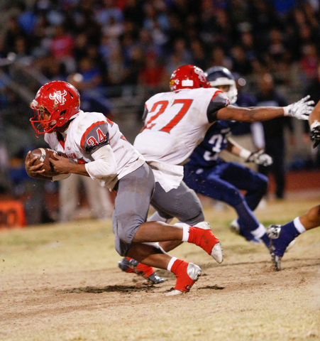 Arbor View’s Denajiou McZeal (27) blocks for teammate Herman Gray (34) in the second h ...