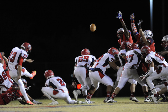 Liberty defenders attempt to block Spencer Cofer’s game-winning field goal attempt on ...