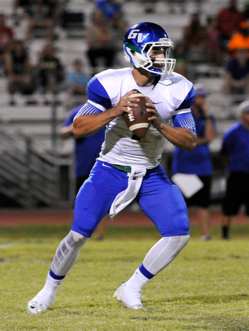 Green Valley quarterback Christian Lopez drops back to pass on Friday against Palo Verde. Lo ...