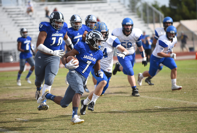 Desert Pines Isaiah Morris (7) runs the ball against South Tahoe during their 3A state semif ...