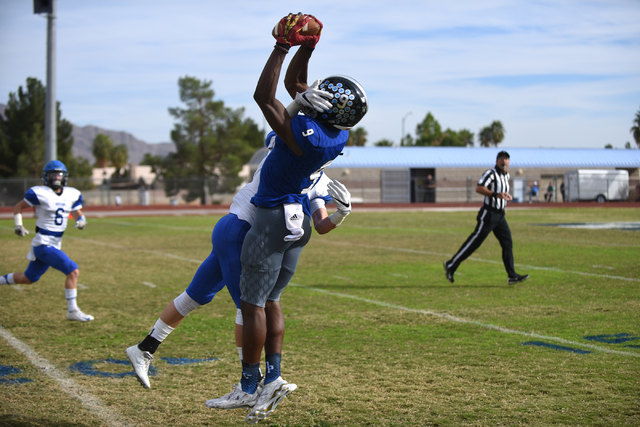 Desert Pines Randal Grimes (9) catches the ball for a first down against South Tahoe during ...