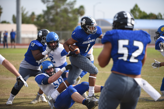Desert Pines Tony Fields (1) runs the ball against South Tahoe during their 3A state semifin ...