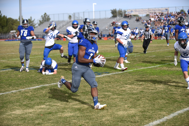 Desert Pines Isaiah Morris (7) runs the ball in for a touch down against South Tahoe during ...