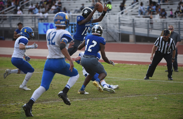Desert Pines Tyler Williamson (19) dives in the end zone for a touch down against South Taho ...