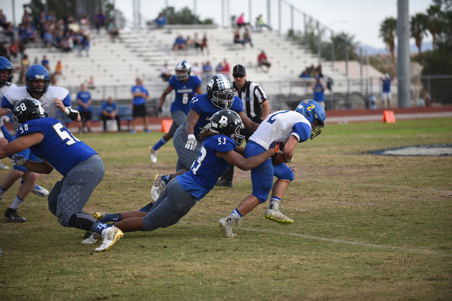 Desert Pines Lorenzo Brown (53) tackles South Tahoe’s Jacob Costly (2) during their 3A ...