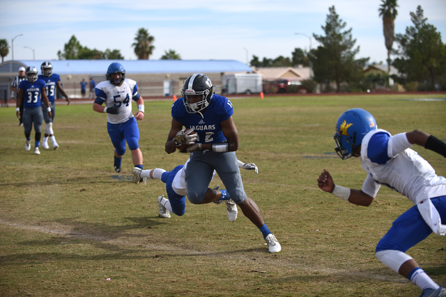 Desert Pines Jordan Simon (12) runs the ball against South Tahoe during their 3A state semif ...