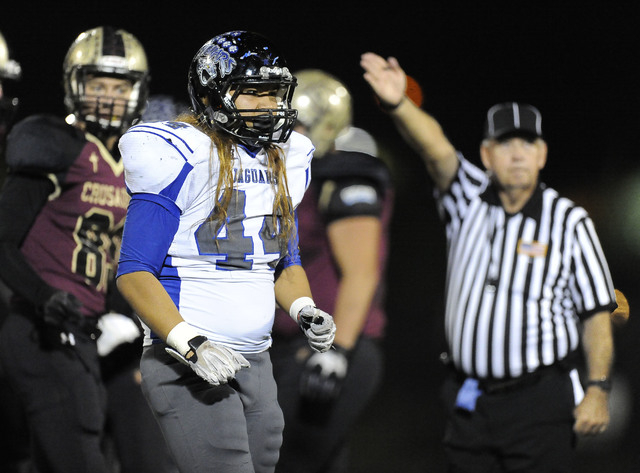 Desert Pines linebacker Vasaifanua Hansell (44) celebrates after Desert Pines recovered a Fa ...