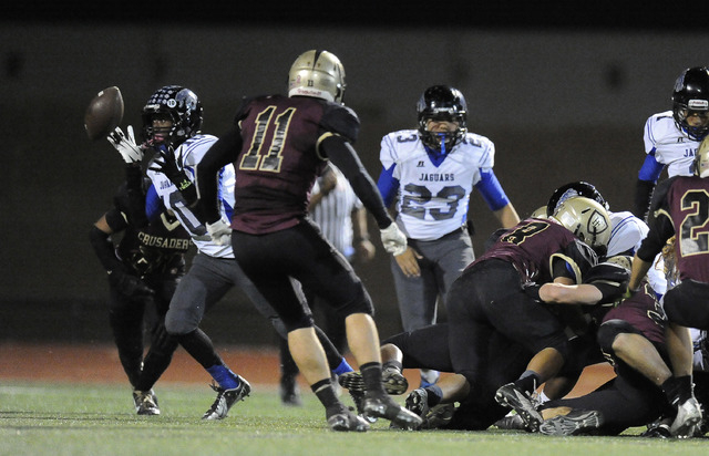 Desert Pines running back Jon McCoy (10) recovers a Desert Pines fumble off a kickoff on Fri ...
