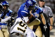 Sierra Vista running back Maliek Broady (31) runs through a tackle by Clark’s Brendon ...