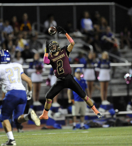 Spring Valley defenders hope to slow Faith Lutheran wide receiver Mark Rubalcaba (2) and the ...