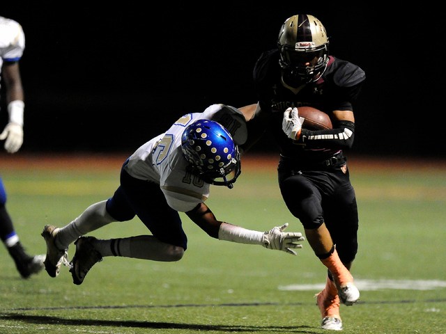 Sierra Vista safety Javion Hunt (16) goes to tackle Faith Lutheran’s Christian Marshal ...