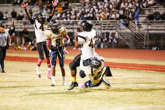 Clark’s Robert Turner (42) is tackled in the end zone by Cheyenne’s Laron Perkin ...