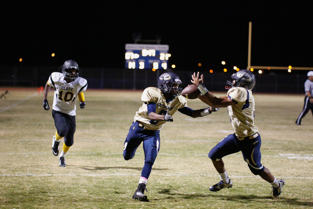 Cheyenne players attempt to catch a pass in the end zone in the second half on Friday agains ...