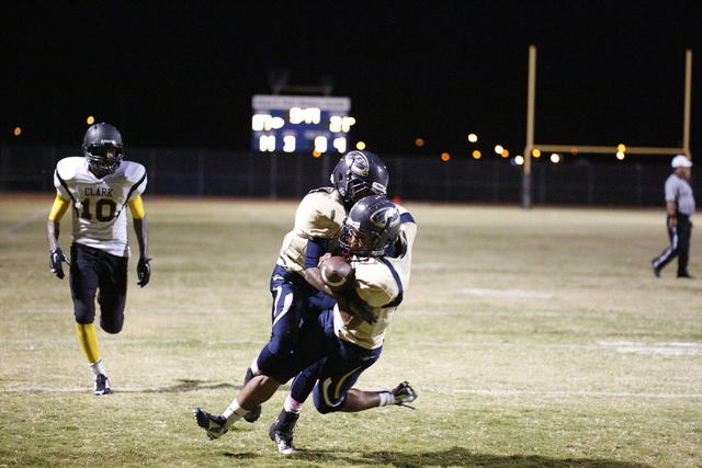 Cheyenne players attempt to catch a pass in the end zone in the second half on Friday agains ...