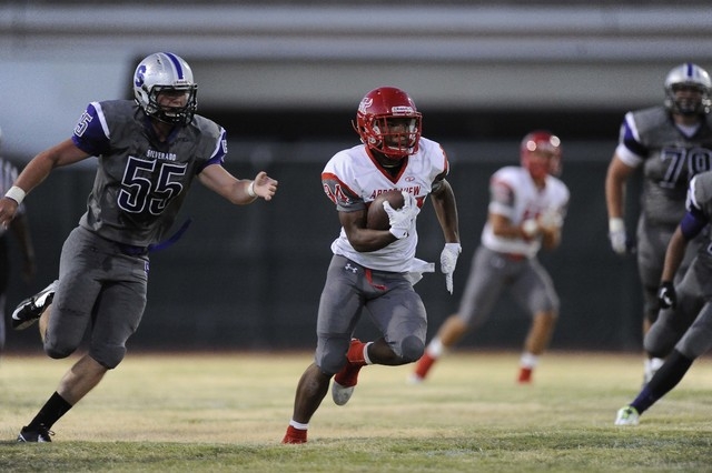 Arbor View running back Herman Gray (34) rushes for a first down against Silverado in the fi ...