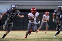 Arbor View running back Herman Gray (34) rushes for a first down against Silverado in the fi ...