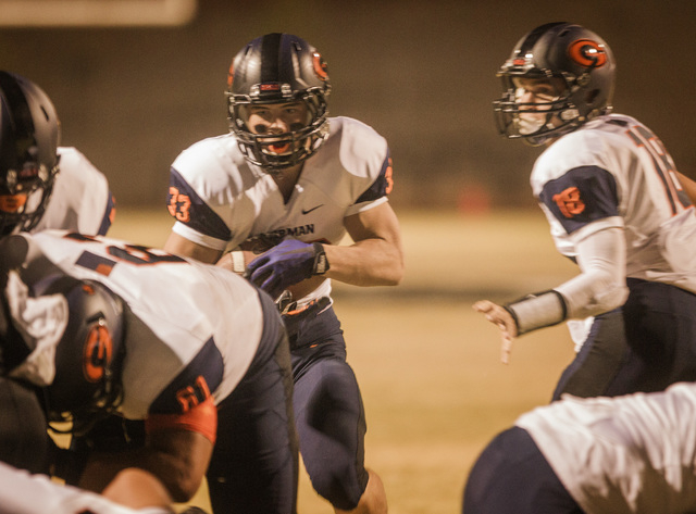 Bishop Gorman halfback Jonathan Shumaker punches in for a touchdown after taking a handoff f ...