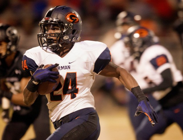 Bishop Gorman halfback Russell Booze drives to the outside to score a touchdown against loc ...