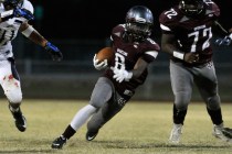 Cimarron-Memorial’s Maurice Bennett (8) breaks free from the pack against Cheyenne on ...