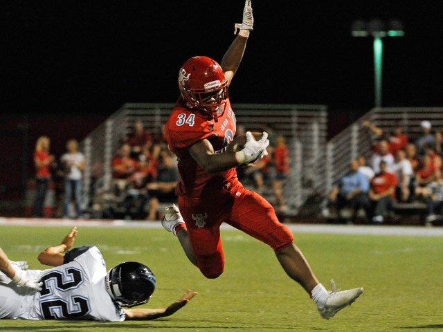 Arbor View’s Herman Gray (34) breaks free from Canyon Springs’ Kyle Stuart in th ...
