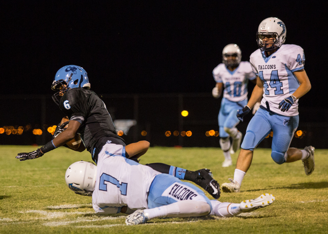 Canyon Springs’ Kasey Allison (6) is tackled by Foothill’s Aedan Bartolowitz on ...