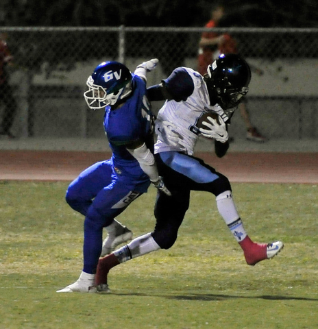 Canyon Springs’ Kujuan Casey, right, runs in for a touchdown as Green Valley’s J ...