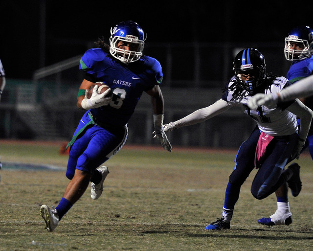 Green Valley’s Brenan Adams (3) carries the ball on Friday against Canyon Springs. Ada ...