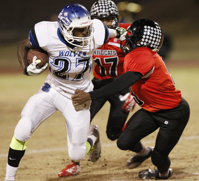 Basic’s Joshua Villaros (27) runs the ball against Las Vegas in the Division I Sunrise ...