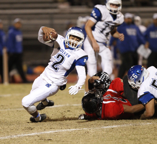 Basic’s quarterback Aeneas McAllister (2) runs the ball against Las Vegas in the Divis ...