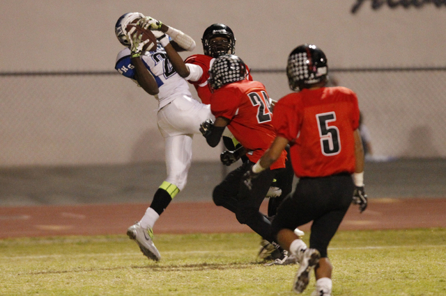 Basic’s Joshua Villaros (27) makes a touchdown catch against Las Vegas in the Division ...