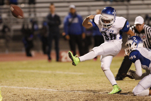 Basic’s Montana Gomez (30) kicks an extra point against Las Vegas in the Division I Su ...