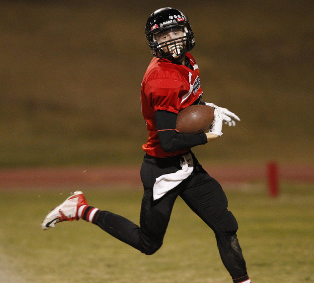 Las Vegas Sam Blackburn (15) runs in for a touchdown against Basic in the Division I Sunrise ...