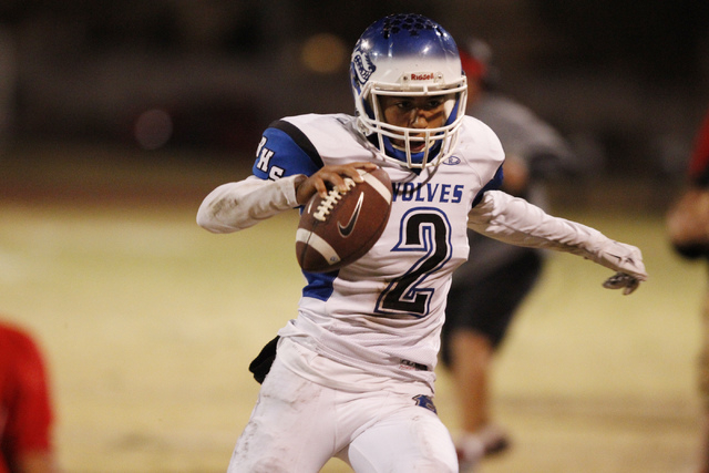 Basic’s quarterback Aeneas McAllister (2) runs the ball against Las Vegas in the Divis ...