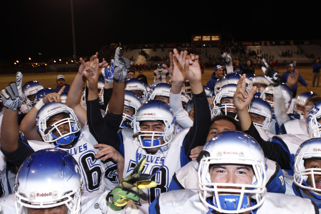Basic players celebrate their 42-32 win over Las Vegas in the Division I Sunrise Regional fo ...