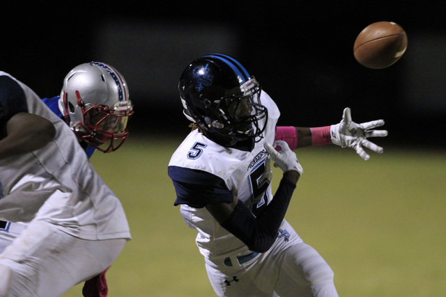 Canyon Springs wide receiver Kajuan Casey drops the ball while being covered by Liberty duri ...
