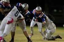 Canyon Springs guard Tui Vergara sacks Liberty quarterback Kenyon Oblad on fourth down durin ...