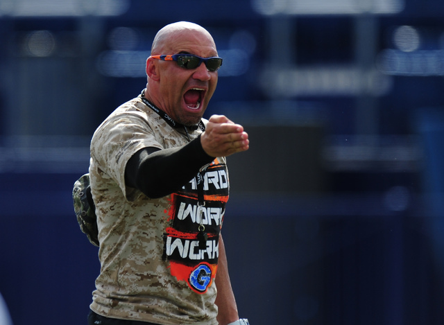 Bishop Gorman head coach Kenny Sanchez yells out instructions during practice at Bishop Gorm ...