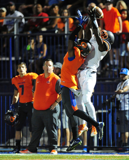 Cocoa, Fla., wide receiver Juwan Armstrong catches a first down pass while Bishop Gorman cor ...
