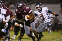 Cimarron-Memorial’s Tyree Riley carries the ball in the first half against Legacy on S ...