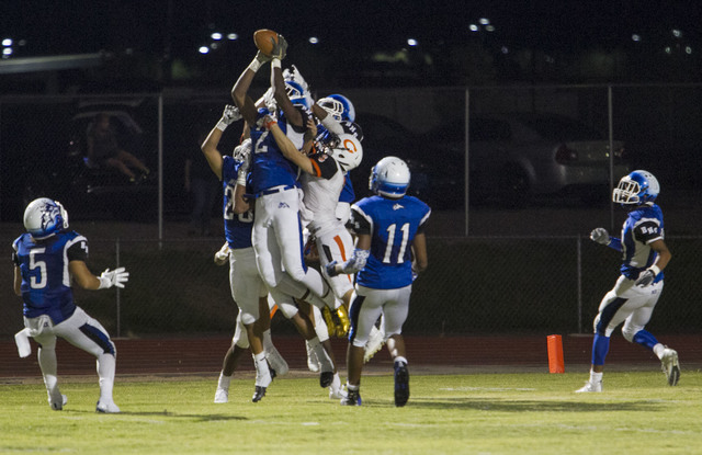 Basicճ De’shawn Eagles (2) catches a ball over Chaparral players during a varsit ...